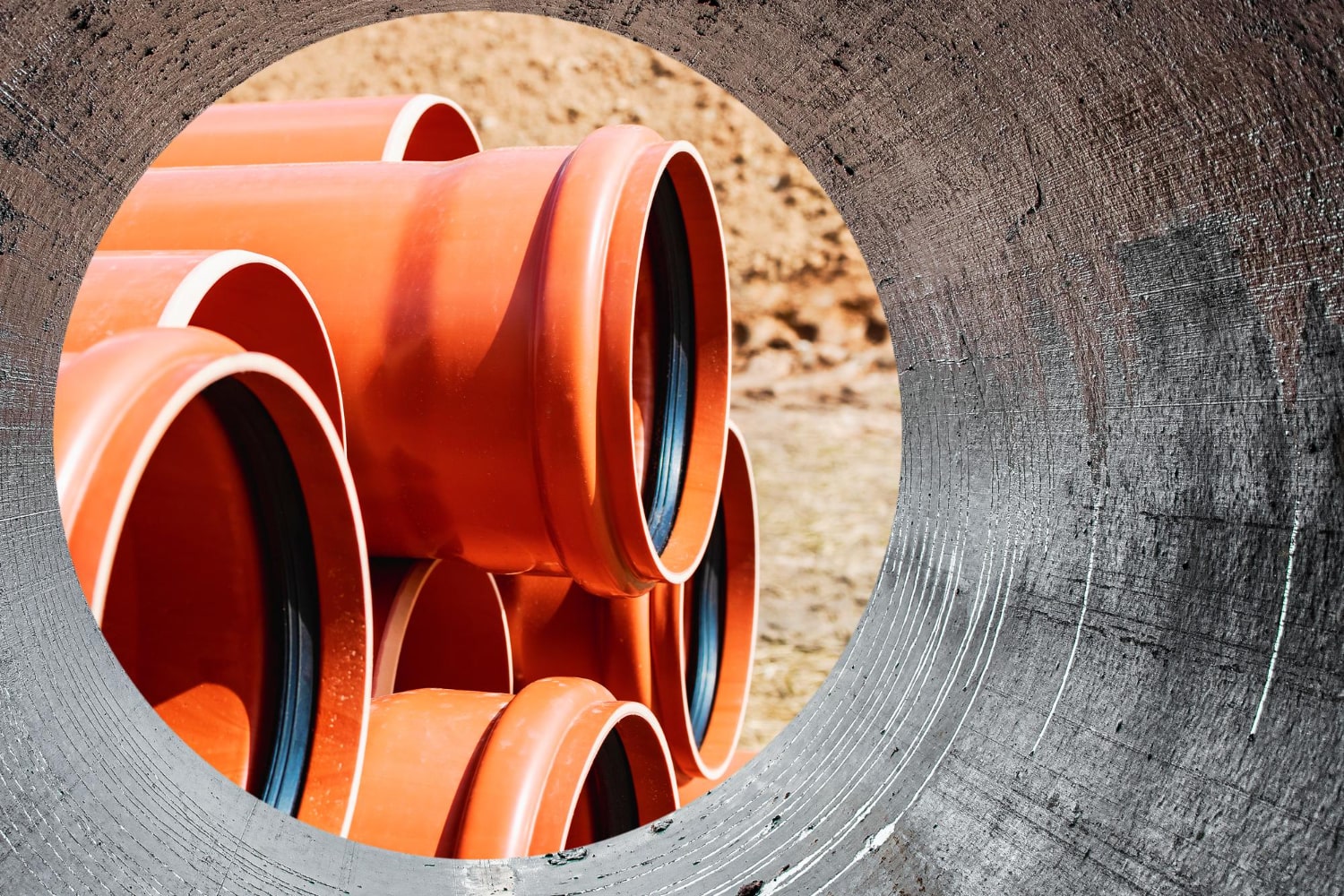 orange-sewer-pipes-close-up-underground-pipeline-works-modern-sewage-disposal-systems-city-water-supply-home-view-from-big-pipe-min